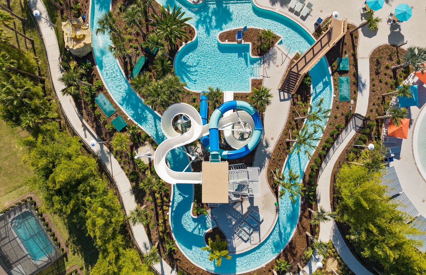 overhead view of double flume waterslide that empties into a lazy river