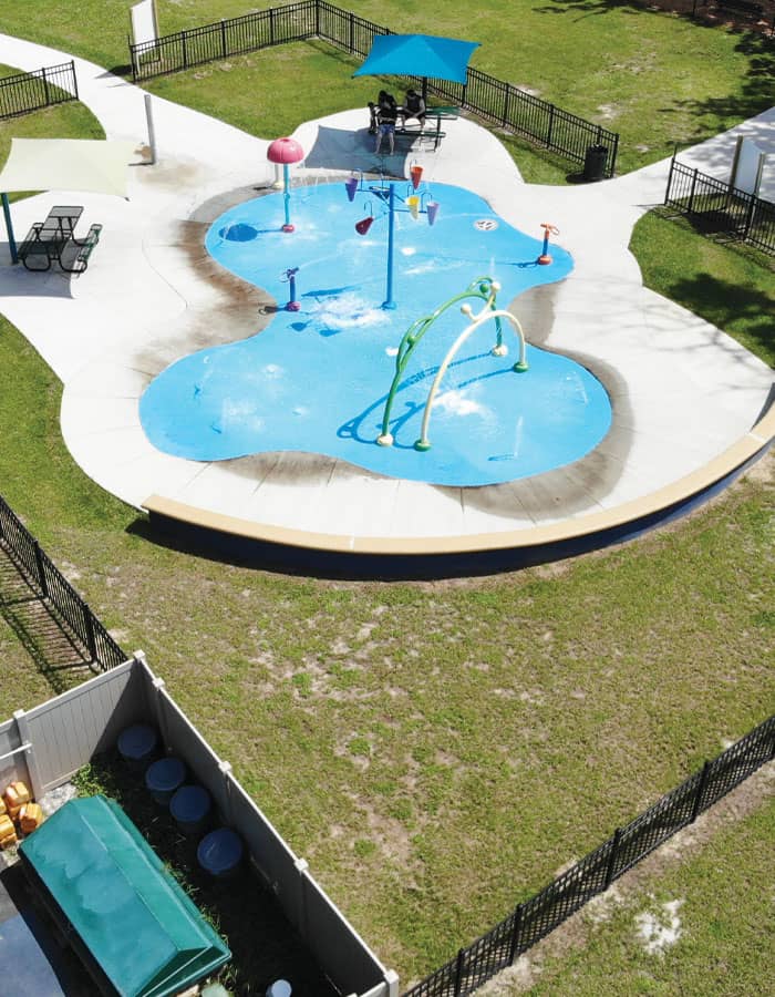 overhead view of community splash pad and recirculating filtration equipment yard