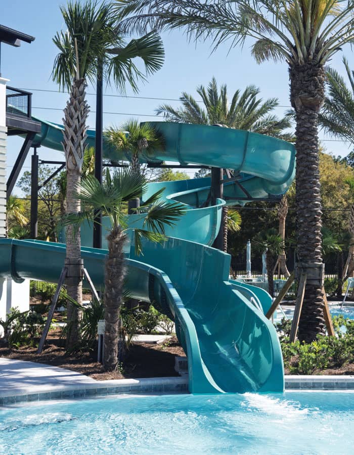 blue waterslides in a tropical setting