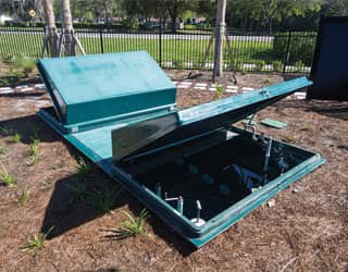 green, dual-lid collector tank