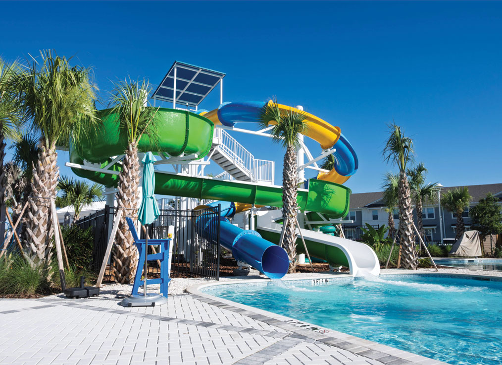 double flume waterslide tower with a blue and yellow closed waterslide and a green open waterslide