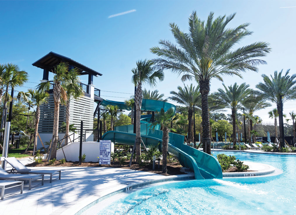 blue waterslides in a tropical setting