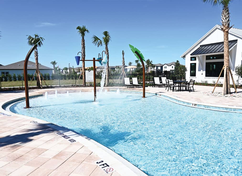 beach entry swimming pool with interactive water features