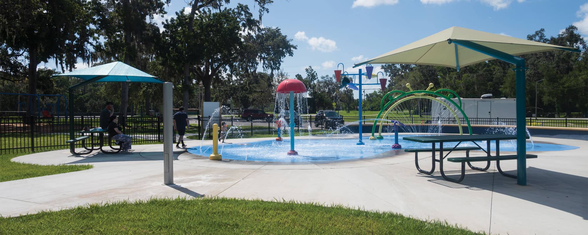 aquatic play area includes interactive splash pad design with moving water features