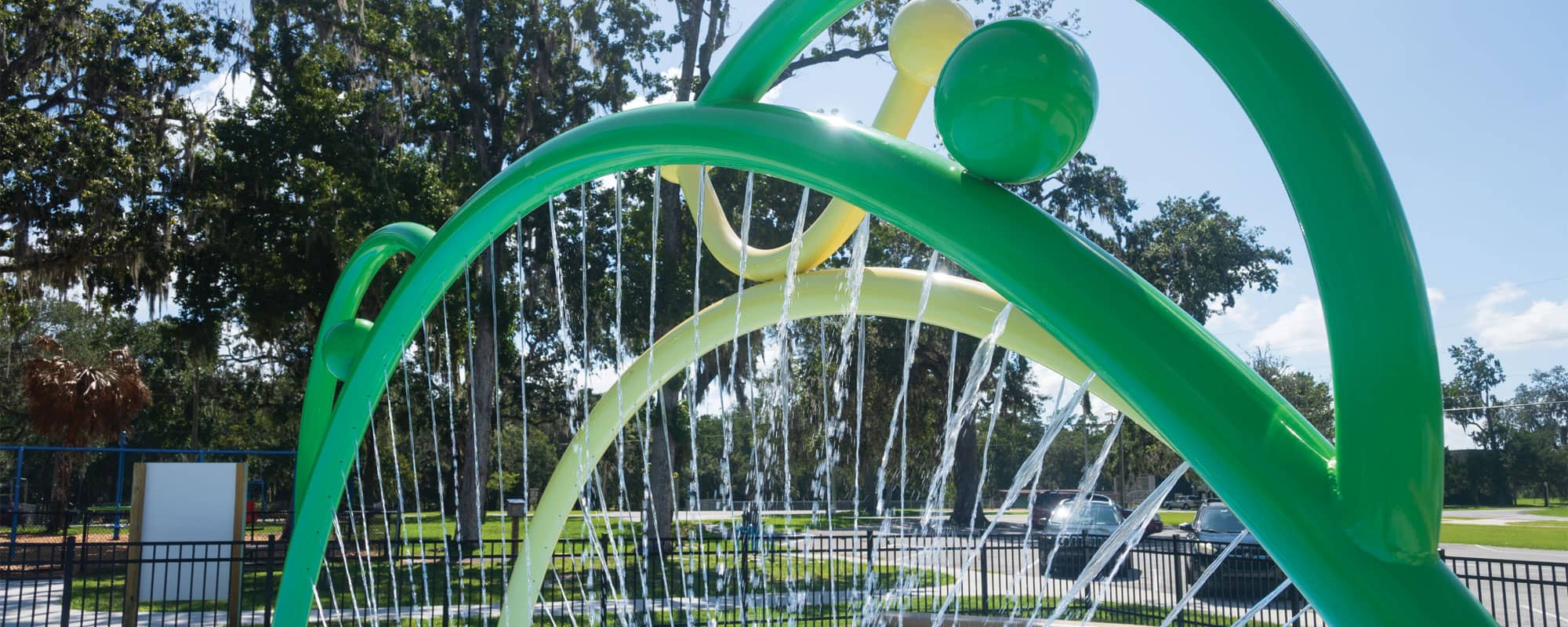 frog-themed arch spraying a curtain of water
