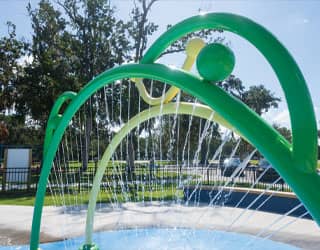 frog-themed arch spraying a curtain of water