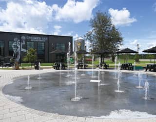 splash pad with ground sprays at an outdoor brewery