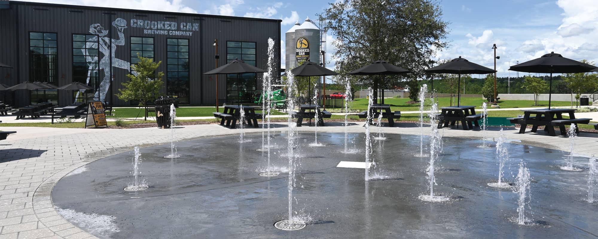 splash pad with ground sprays at an outdoor brewery