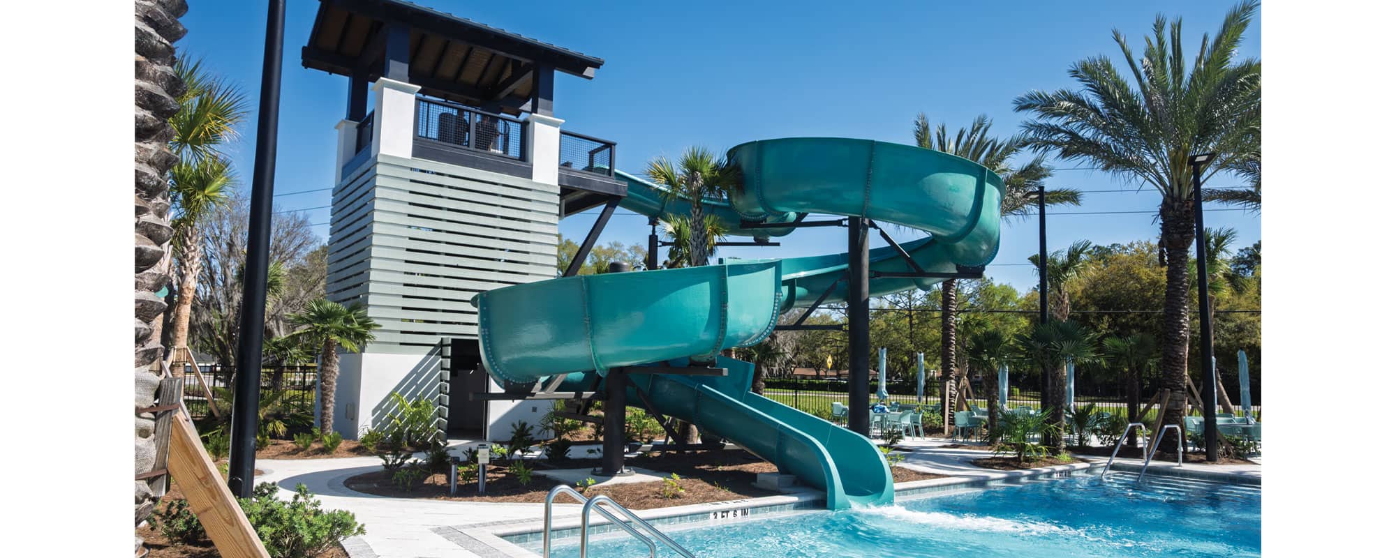 large, open flume waterslide that is painted blue