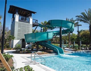 large, open flume waterslide that is painted blue