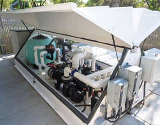 inside of the splash pads recirculating filtration system that shows sand filters and pumps