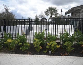 gated equipment yard with white filtration equipment packs