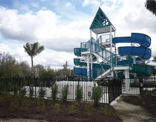 steel staircase for a double flume waterslide and white filtration equipment packs