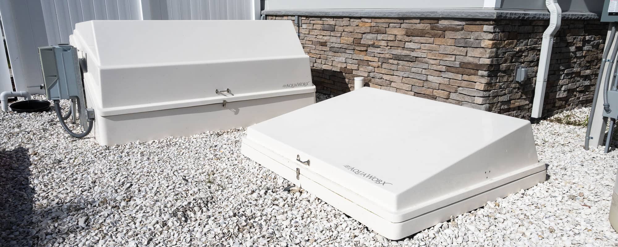 the water slide pumping station is housed in white equipment packs