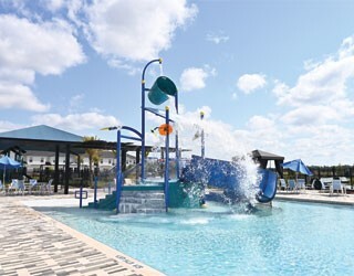 blue water playset with large dumping bucket in a swimming pool