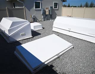 equipment yard for swimming pool with white filtration equipment cabinets