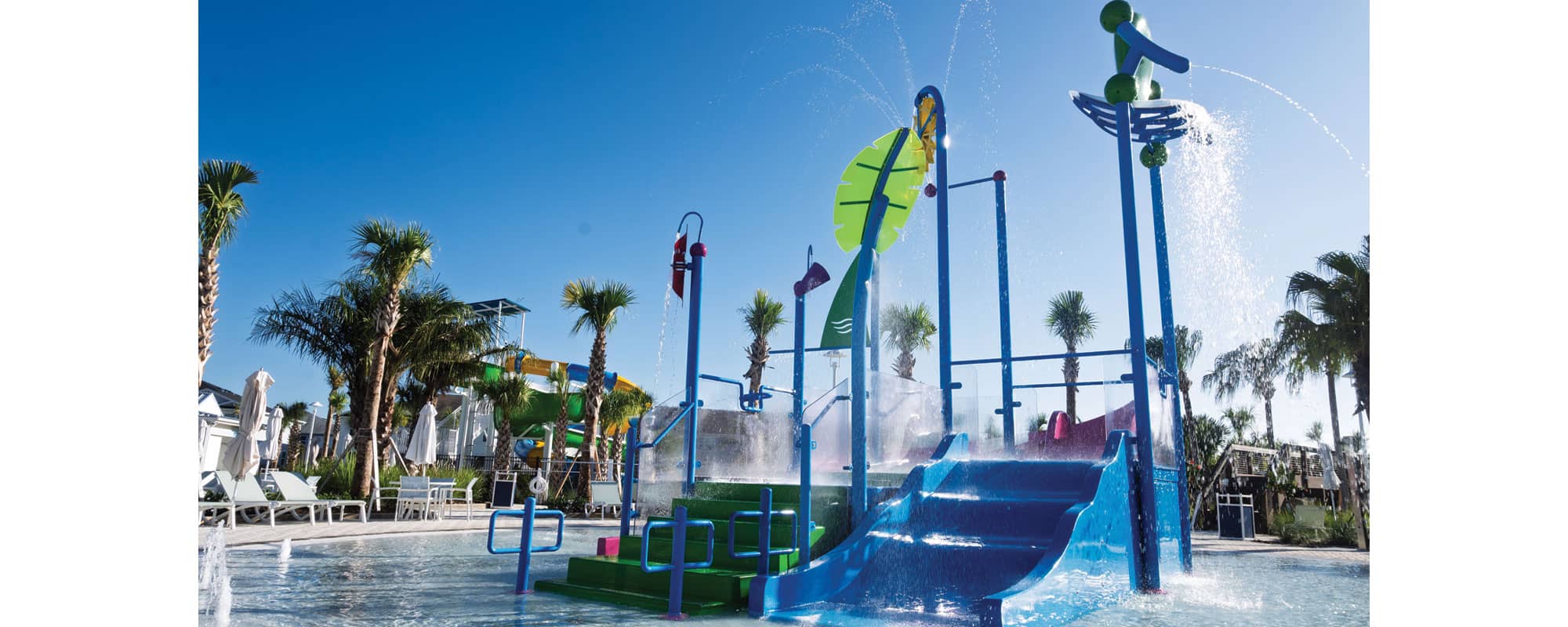 multi-level water playset with waterslide and interactive water features in a kiddie pool