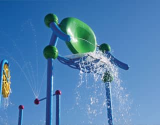 massive splash dumping bucket on a multi-level water playset